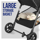 Lightweight stroller featuring a large storage basket with a quilted bag and a stuffed animal visible inside.