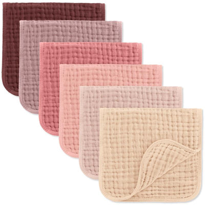 Set of six muslin burp cloths in various shades of pink and burgundy, featuring a soft, textured design.