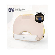 Smart nursing pillow in soft beige with built-in night light and adjustable support strap.