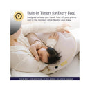 Smart nursing pillow with built-in timers, shown being used by a mother feeding her baby, emphasizing hands-free convenience.
