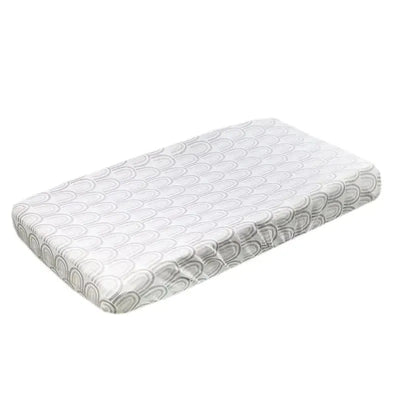 Knit diaper changing pad cover in a gray and white arc pattern, designed for easy cleaning and comfort.