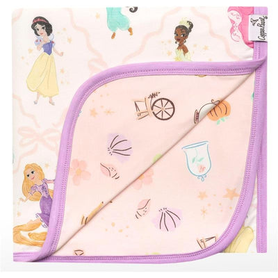 Disney Princess 3-layer quilt featuring characters like Snow White, Tiana, and Rapunzel, with pastel colors and detailed patterns.