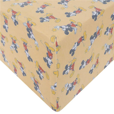 Crib sheet featuring a playful Mickey Mouse design against a yellow background, ideal for a Disney-themed nursery.
