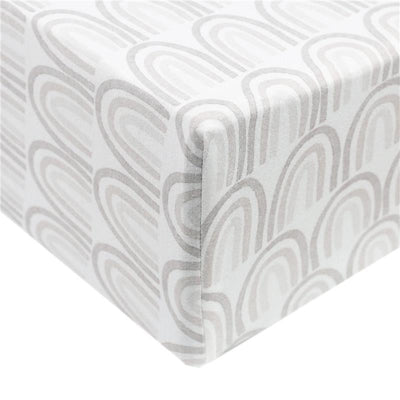 Premium knit baby crib sheet featuring a soft, breathable material with a grey rainbow pattern, designed for standard mattresses.