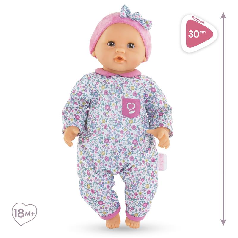 Soft-bodied Corolle doll Bébé Calin Capucine, 30cm, wearing a floral outfit with a pink bow, suitable for ages 18 months and up.
