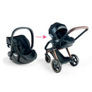 Cybex black stroller and infant car seat with a transition arrow, showcasing compatibility and versatility.
