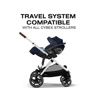 Cybex Cloud G Pro Comfort Extend Infant Car Seat in Ocean Blue, attached to a stroller with a travel system compatibility label.