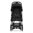 Cybex Coya stroller with a matte black frame and sepia black fabric, featuring a padded seat and adjustable canopy.