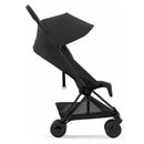 Cybex Coya stroller featuring a matte black frame and sepia black fabric, highlighting its compact design and large canopy.