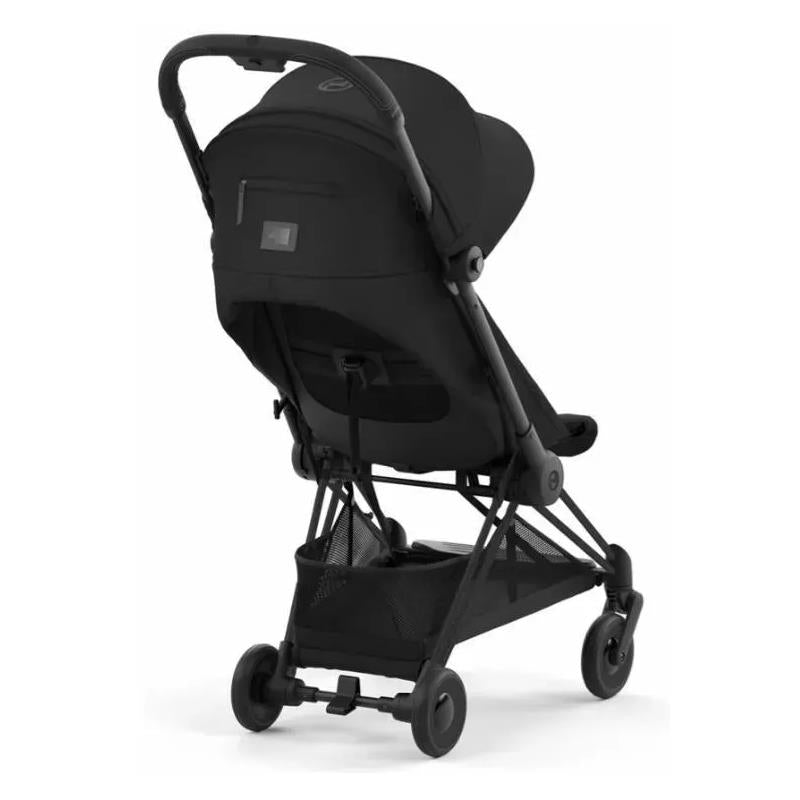 Cybex Coya stroller featuring a matte black frame and sepia black fabric, shown from the rear with a large sun canopy.