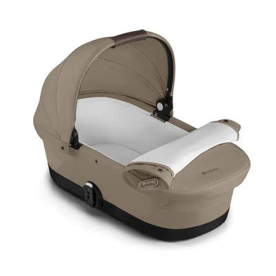 Cybex Egazelle/Gazelle S 2 Cot in Almond Beige, featuring a soft interior and a protective canopy.
