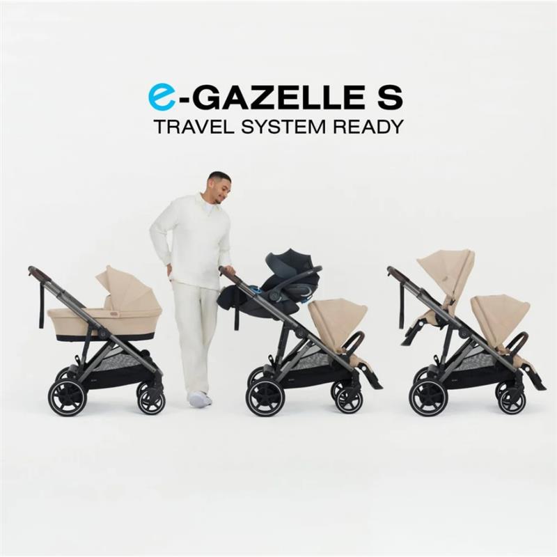 Cybex e-Gazelle S stroller with taupe frame and chocolate brown seat, featuring a man transporting the stroller system.