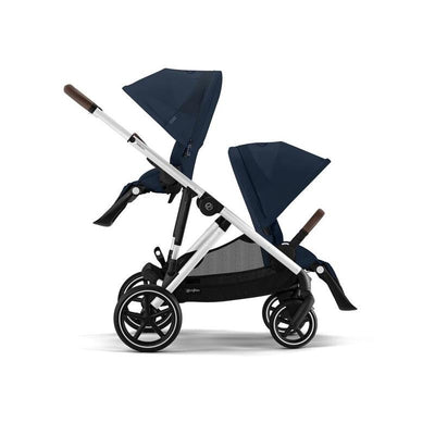 Cybex Gazelle S 2 double stroller bundle features an ocean blue color with a silver frame, designed for two children.