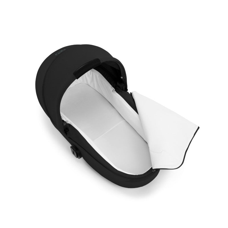 Foldable Cybex Gazelle S Cot in Moon Black with a white interior, designed for infant transportation.