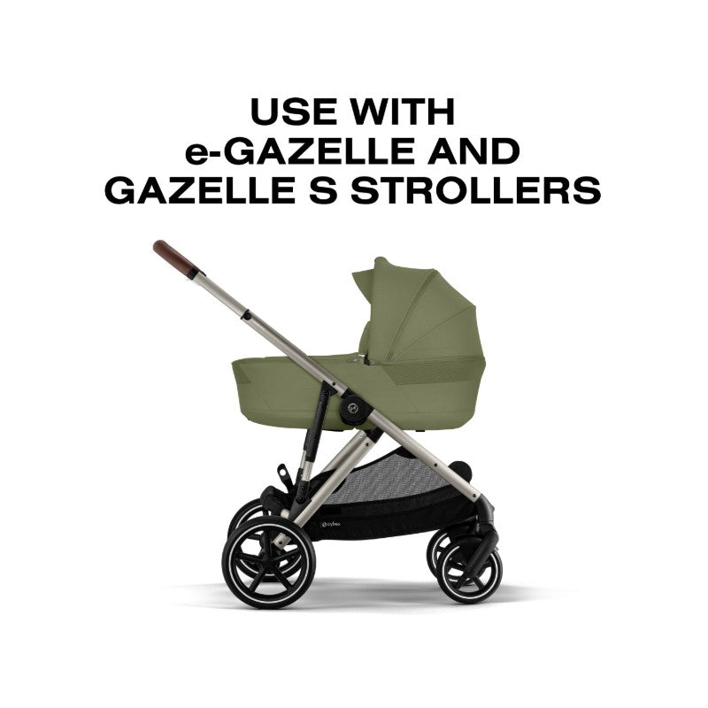 Cybex Gazelle S Cot in Moss Green, designed for use with e-Gazelle and Gazelle S strollers, shown at an angle.