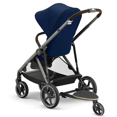 Cybex Gazelle S Kid board attached to a stroller, featuring a navy seat, adjustable canopy, and supportive handle.