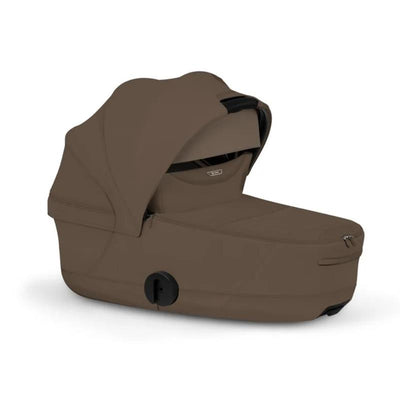 Cybex Mios/Coya Fold Lux Carry Cot in Coconut Brown, featuring a sleek design and expandable canopy for infants.