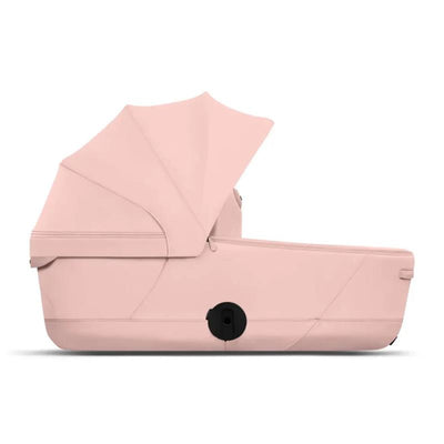Cybex Mios/Coya Fold Lux Carry Cot in peach pink with a sun canopy and a sleek design, ideal for infants.