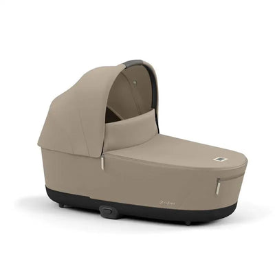 Cybex Priam4/Epriam2 Lux Cot in Cozy Beige, featuring a smooth design with a canopy and a zippered compartment.