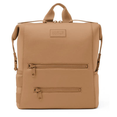 Large camel-colored Dagne Dover Indi diaper backpack with a smooth finish, featuring two front zippered pockets and a top handle.