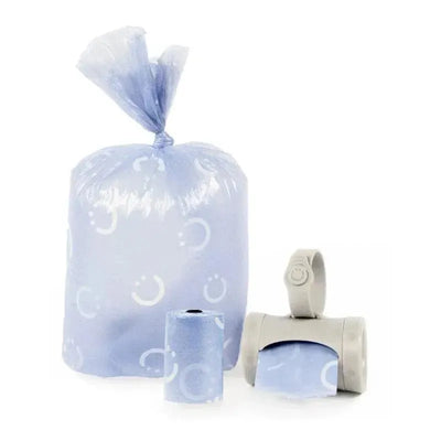 Lavender-scented Ubbi on-the-go refill bags, featuring a pack, a roll, and a dispenser, designed for easy waste disposal.