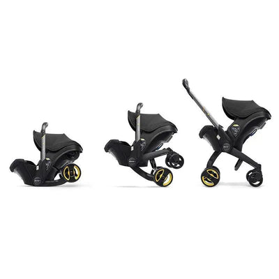 Doona infant car seat and stroller in Nitro Black, showing its unique convertible design with three configurations.