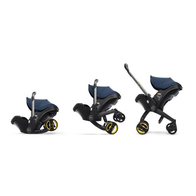 Deep blue Doona infant car seat with base shown in three angles, highlighting its versatile design and functionality.