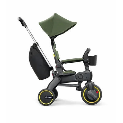 Doona Liki Trike S3 in Desert Green, featuring a compact design, adjustable canopy, and storage bag.