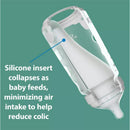 Dr. Brown 9 oz silicone baby bottle in blue, featuring a collapsible silicone insert to minimize air intake and reduce colic.