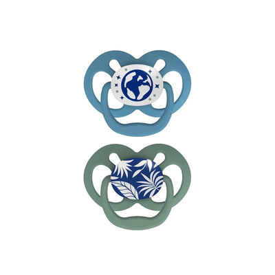 Two Dr. Brown’s Advantage Pacifiers, Stage 2, in blue and green, featuring glow-in-the-dark designs with planet and leaf patterns.