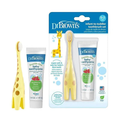 Training toothbrush set featuring a yellow giraffe-shaped brush and strawberry-flavored fluoride-free toothpaste for infants.