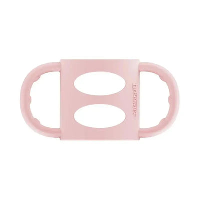 Light pink silicone baby bottle handles with ergonomic grips and openings for easy holding.