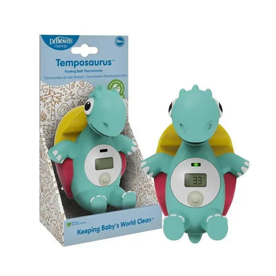 Floating bath thermometer in teal dinosaur shape with a digital display showing temperature, packaged for baby use.