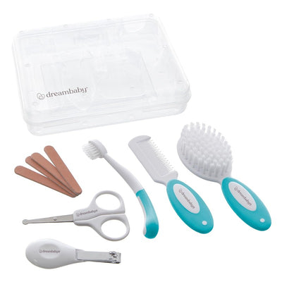 Dreambaby Essential Grooming Kit in Aqua, featuring scissors, nail clippers, a comb, a brush, a toothbrush, and emery boards, in a clear case.