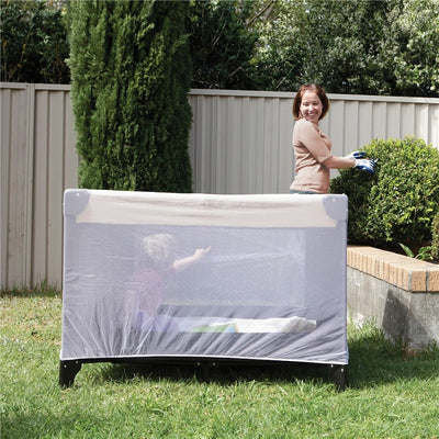 Play yard with insect netting; a child inside pointing while a smiling woman in gloves tends to nearby plants.