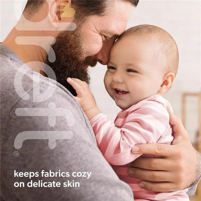 Dreft Newborn Baby Liquid Laundry Detergent promotes comfort for delicate skin, showcasing a joyful baby in a striped onesie with a smiling father.