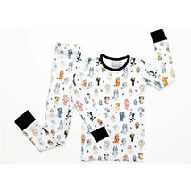 Blue dog-patterned bamboo pajamas featuring colorful cartoon dogs on a white background, with black cuffs.