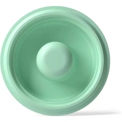 Green Elvie Stride Diaphragm X2, featuring a smooth, rounded design for effective diaphragm use.
