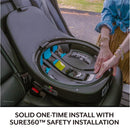 Evenflo Revolve360 Slim 2-in-1 car seat displayed with a person demonstrating its Sure360™ safety installation features.