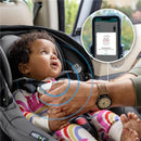 Infant in Evenflo Shyft Dualride car seat, secured and smiling, with a smartphone displaying safety information.