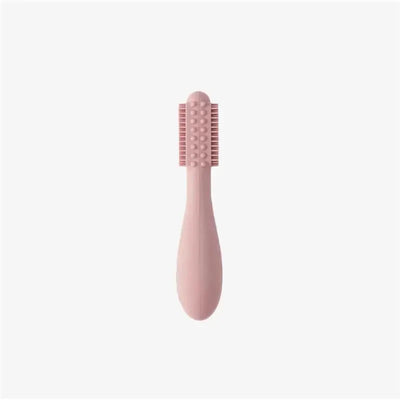 Baby-Led™ Toothbrush in blush color with soft bristles and textured handle for easy gripping.