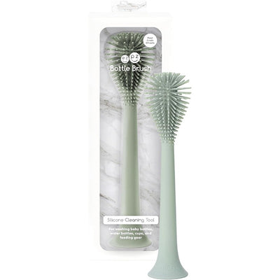 Ezpz Bottle Brush Cleaner in sage color, designed for cleaning baby and water bottles, featuring a silicone bristle head.