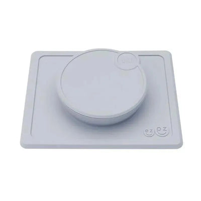 Ezpz Mini Bowl Lid in pewter color, featuring a circular bowl on a square base designed to prevent spills.