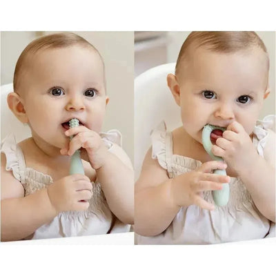 Baby using the Ezpz Blush oral development tool, chewing and exploring its textured design for teething relief.