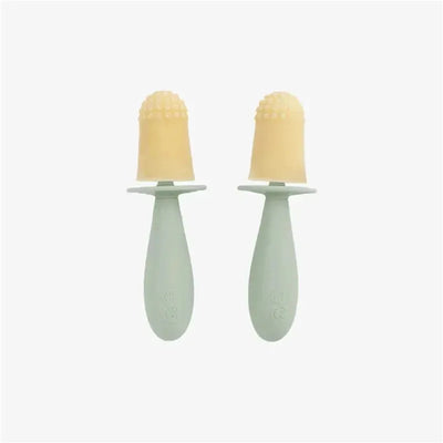 Tiny Popsicle mold set in sage green with two yellow popsicles and wands, designed for making homemade treats.