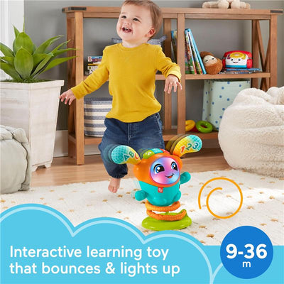 Interactive Fisher Price DJ Bouncin’ Beats learning toy with lights, designed for infants 9-36 months, shown with a smiling toddler.