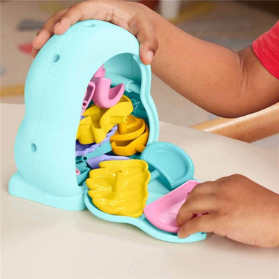 Colorful Fisher Price Baby Toys So Many Senses Set with various shape sorting pieces, being actively engaged by a child.