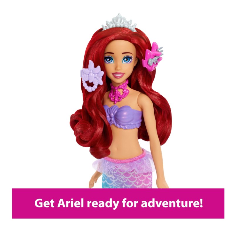 Mermaid doll Ariel wearing a purple top and pink skirt, styled with a tiara and accessories, ready for play.