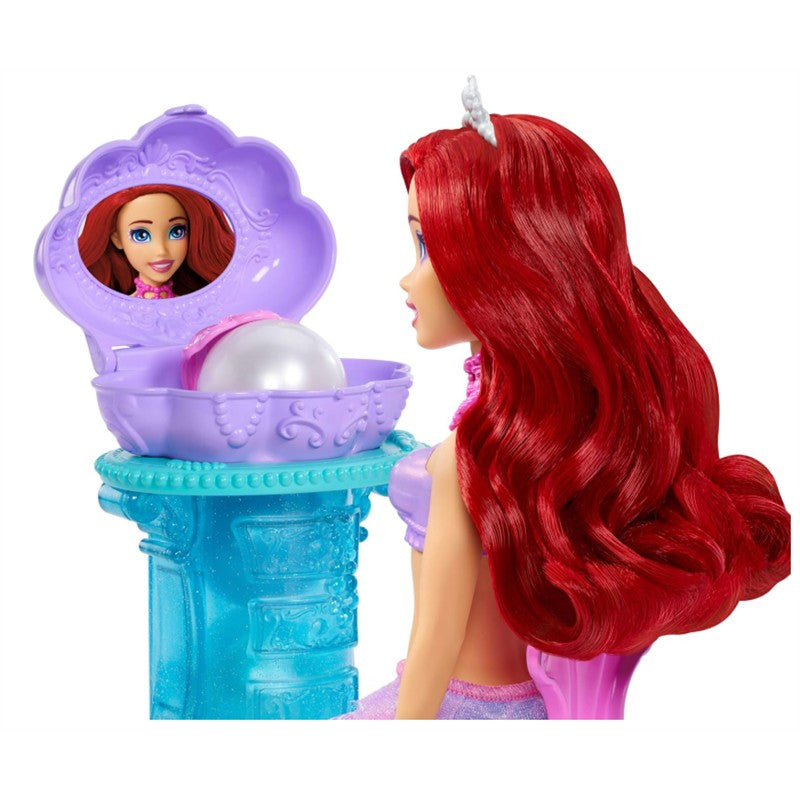 Fisher Price Disney Princess Ariel Mermaid Surprise Playset features Ariel doll with vibrant red hair, a pearl in a purple shell on a turquoise pedestal.