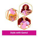 Fisher Price Disney Princess Fashion Doll Reveal featuring Ariel in a pink dress with a decorated skirt and gems.